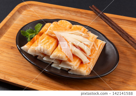 imitation Crab Sticks Cut Slices on Plate 142141588