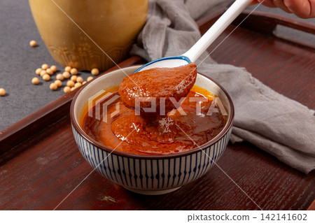 savory Brown Sauce Paste in Blue Ceramic Bowl savory Brown Sauce Paste in Blue Ceramic Bowl 142141602