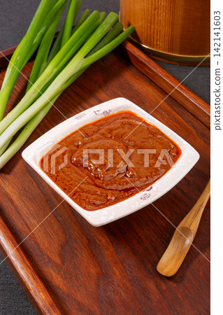 savory Brown Sauce Paste in Blue Ceramic Bowl savory Brown Sauce Paste in Blue Ceramic Bowl 142141603