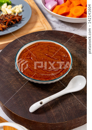 savory Brown Sauce Paste in Blue Ceramic Bowl savory Brown Sauce Paste in Blue Ceramic Bowl 142141604