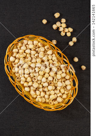 dried White Lotus Seeds in Woven Basket dried White Lotus Seeds in Woven Basket 142141665