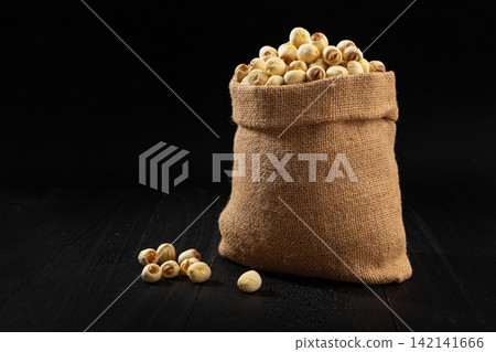 dried White Lotus Seeds in Woven Basket dried White Lotus Seeds in Woven Basket 142141666