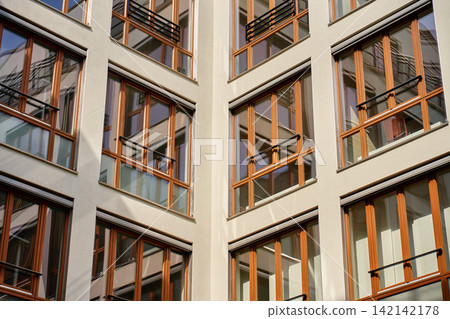 Modern Apartment Building with Large Windows 142142178