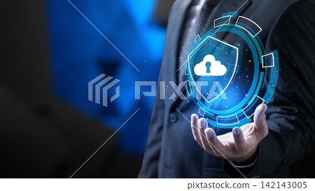 Businessman holding glowing holographic shield with cloud and keyhole icon, representing advanced cloud computing security and data protection. Concept of Cloud Data Protection Businessman holding glowing holographic shield with cloud and keyhole icon, representing advanced cloud computing security and data protection. Concept of Cloud Data Protection 142143005