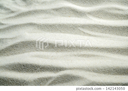 White sand texture with elegant ripple patterns, perfect for zen, relaxation, spa, and minimalist backgrounds. Summer, natural or texture background White sand texture with elegant ripple patterns, perfect for zen, relaxation, spa, and minimalist backgrounds. Summer, natural or texture background 142143050