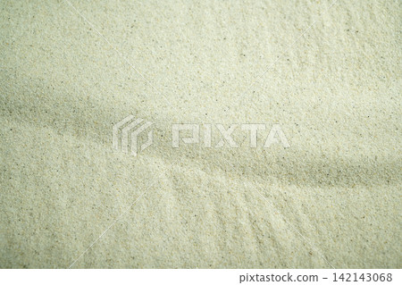 White sand texture with elegant ripple patterns, perfect for zen, relaxation, spa, and minimalist backgrounds. Summer, natural or texture background White sand texture with elegant ripple patterns, perfect for zen, relaxation, spa, and minimalist backgrounds. Summer, natural or texture background 142143068