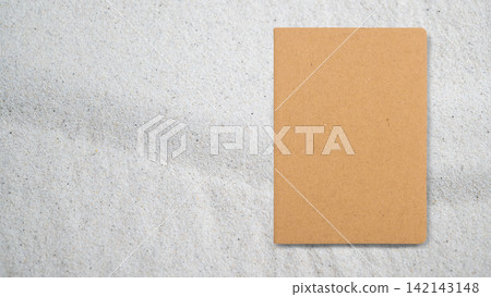 Blank brown kraft notebook on light textured grey surface with copy space Blank brown kraft notebook on light textured grey surface with copy space 142143148