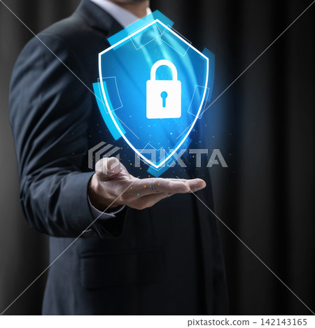 Businessman holding glowing blue digital shield with padlock, representing cybersecurity and data protection. Concept of Digital Protection Businessman holding glowing blue digital shield with padlock, representing cybersecurity and data protection. Concept of Digital Protection 142143165