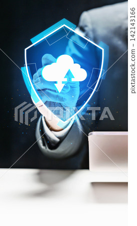 Businessman interacting with a glowing blue digital shield containing a cloud upload and download icon, representing secure cloud storage and data protection. Concept of Digital Protection Businessman interacting with a glowing blue digital shield containing a cloud upload and download icon, representing secure cloud storage and data protection. Concept of Digital Protection 142143166