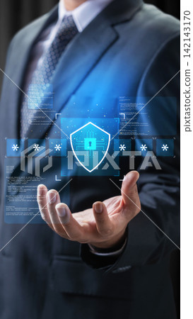Businessman holding a glowing holographic shield icon with asterisks, representing cybersecurity and password protection. Concept of multi-factor authentication login 142143170