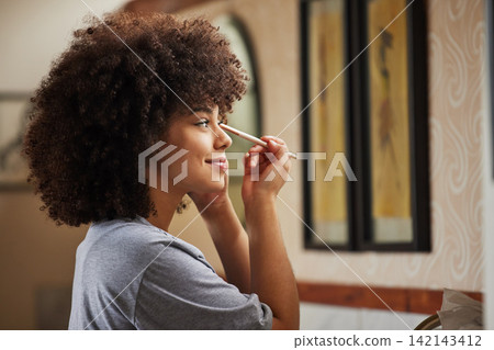 Profile, makeup or girl in bathroom with brush for morning routine or grooming on mirror in home, house. Eyeshadow cosmetics, afro or woman with product for natural skincare, beauty glow or wellness 142143412