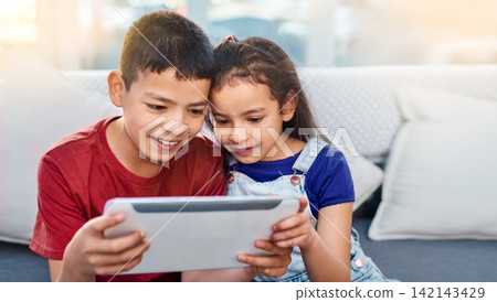 Tablet, children and siblings on couch for play, online and esports for entertainment. Technology, streaming and internet for video in lounge, smile and gaming on digital or mobile app on touchscreen Tablet, children and siblings on couch for play, online and esports for entertainment. Technology, streaming and internet for video in lounge, smile and gaming on digital or mobile app on touchscreen 142143429