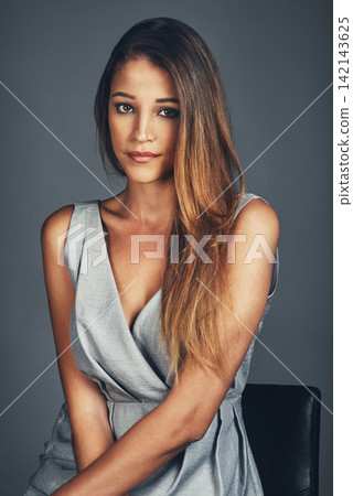 Portrait, woman and beauty on dark background for fashion, style and pose in backdrop. Female person, confidence and pride in clothes, cosmetics or makeup for salon or haircare in studio or backdrop Portrait, woman and beauty on dark background for fashion, style and pose in backdrop. Female person, confidence and pride in clothes, cosmetics or makeup for salon or haircare in studio or backdrop 142143625