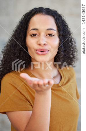 Woman, portrait and blowing a kiss for flirting, love and romance with cute gesture for relationship. Confidence, happy and emoji with lips or mouth, emotion and expression of feelings for affection Woman, portrait and blowing a kiss for flirting, love and romance with cute gesture for relationship. Confidence, happy and emoji with lips or mouth, emotion and expression of feelings for affection 142143627
