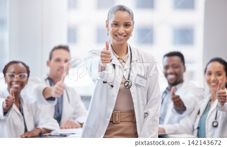 Happy woman, portrait and doctor with thumbs up in meeting for teamwork, success or approval at hospital. Female person, medical employee or group with smile, like emoji or yes sign for agreement Happy woman, portrait and doctor with thumbs up in meeting for teamwork, success or approval at hospital. Female person, medical employee or group with smile, like emoji or yes sign for agreement 142143672