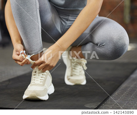 Sneakers, shoelaces and tying for fitness, gym and workout start for health and wellness. Athlete, cardio and warmup for muscle performance, sneakers and training with exercise routine and yoga mat Sneakers, shoelaces and tying for fitness, gym and workout start for health and wellness. Athlete, cardio and warmup for muscle performance, sneakers and training with exercise routine and yoga mat 142143890