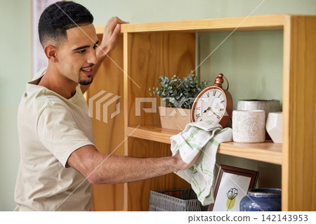 Cleaning, shelf and man in home to wipe with spray for chores, housework or responsibility. Bacteria, cloth, and disinfectant with person scrubbing surface in apartment for control or hygiene Cleaning, shelf and man in home to wipe with spray for chores, housework or responsibility. Bacteria, cloth, and disinfectant with person scrubbing surface in apartment for control or hygiene 142143953