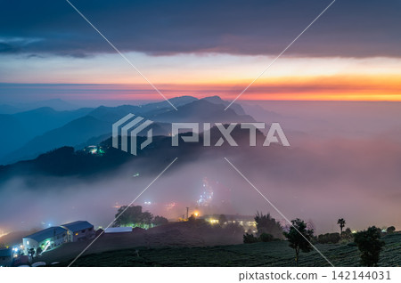 Alishan Night Landscape with Sea of Clouds and Tea Plantation Alishan Night Landscape with Sea of Clouds and Tea Plantation 142144031