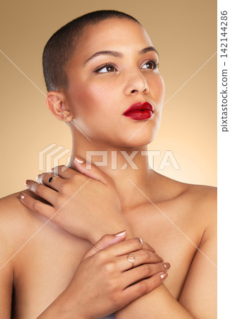Proud, makeup and woman in studio, hand and natural beauty, glow and shine of face and aesthetic. Background, person and girl with red lipstick, foundation and cosmetics of model with results 142144286