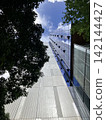 The sky seen through the buildings 142144427