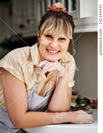 Woman, portrait and happiness in kitchen with flour, apron and cooking or baking for cake, cookies and face. Chef, happy and cook for baker at home, health and nutrition for meal or ingredients Woman, portrait and happiness in kitchen with flour, apron and cooking or baking for cake, cookies and face. Chef, happy and cook for baker at home, health and nutrition for meal or ingredients 142144433
