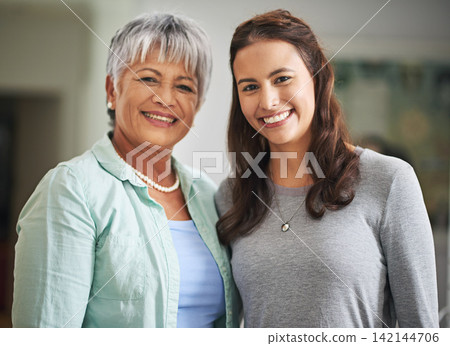 Portrait, senior woman and daughter in house with love for relationship, Mothers Day and support. Smile, happy and face of mature parent with girl in home for quality time, retirement and together Portrait, senior woman and daughter in house with love for relationship, Mothers Day and support. Smile, happy and face of mature parent with girl in home for quality time, retirement and together 142144706