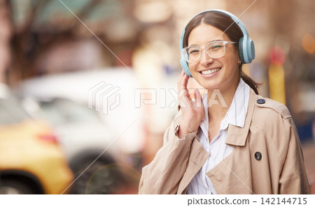 Business woman, headphones and city for taxi, travel and smile with audio streaming subscription. Person, space and urban sidewalk with waiting for transportation on commute to workplace in New York Business woman, headphones and city for taxi, travel and smile with audio streaming subscription. Person, space and urban sidewalk with waiting for transportation on commute to workplace in New York 142144715