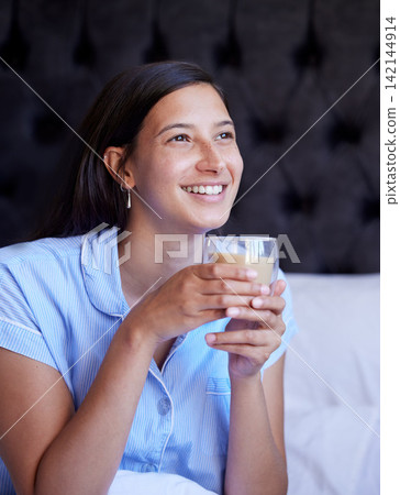 Woman, tea and smile in bed, morning and thinking with vision, choice and future with pyjamas in apartment. Girl, person and relax in bedroom with drink, coffee and happy for ideas at house in Naples Woman, tea and smile in bed, morning and thinking with vision, choice and future with pyjamas in apartment. Girl, person and relax in bedroom with drink, coffee and happy for ideas at house in Naples 142144914
