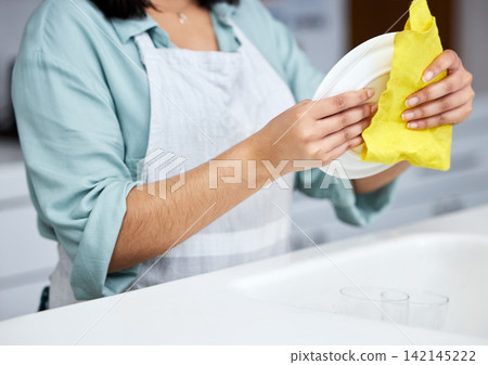 Cleaning, washing dishes or woman with plate, hands and cloth in kitchen sink or basin in healthy home. Dirty, messy germs or maid cleaner with liquid foam to disinfect, protect and prevent bacteria Cleaning, washing dishes or woman with plate, hands and cloth in kitchen sink or basin in healthy home. Dirty, messy germs or maid cleaner with liquid foam to disinfect, protect and prevent bacteria 142145222