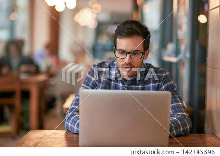 Businessman, laptop and remote work in coffee shop for online research, communication and networking. Male freelance writer, technology and connection for social media and ideas for contact in cafe Businessman, laptop and remote work in coffee shop for online research, communication and networking. Male freelance writer, technology and connection for social media and ideas for contact in cafe 142145396