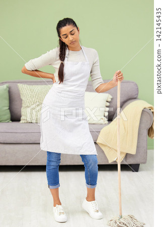 Woman, tired and mop floor in home, hygiene and thinking to stop germs, bacteria and dust with fatigue. Person, burnout and housework in apartment for dirt, spring cleaning and disinfection in lounge Woman, tired and mop floor in home, hygiene and thinking to stop germs, bacteria and dust with fatigue. Person, burnout and housework in apartment for dirt, spring cleaning and disinfection in lounge 142145435