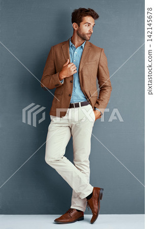Business, fashion and man with confidence, thinking and creative professional in studio. Inspiration, trendy style and businessman on grey background with pride, opportunity and designer clothes. Business, fashion and man with confidence, thinking and creative professional in studio. Inspiration, trendy style and businessman on grey background with pride, opportunity and designer clothes. 142145678