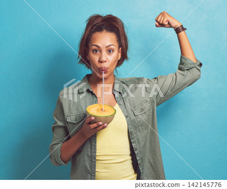 Strong, muscle and portrait of woman with fruit, melon and smoothie for benefits to health. Food, nutrition and diet with protein, vitmain c or fiber for energy or tips for wellness from body builder Strong, muscle and portrait of woman with fruit, melon and smoothie for benefits to health. Food, nutrition and diet with protein, vitmain c or fiber for energy or tips for wellness from body builder 142145776