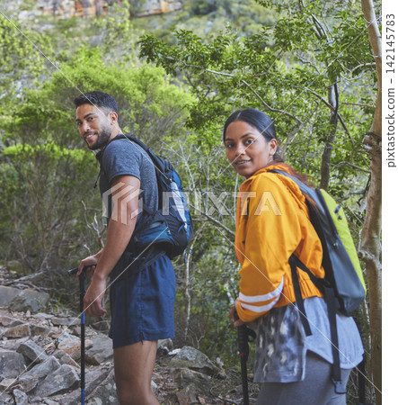 Couple, portrait and stick for hiking in forest with backpack, adventure and morning workout for summer fitness. People, trail walk and happy for exercise, training and explore on mountain for cardio 142145783