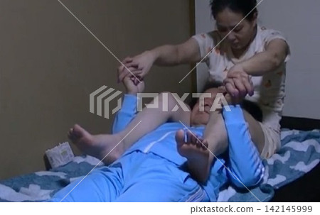 Tall women doing pair stretching Tall women doing pair stretching 142145999