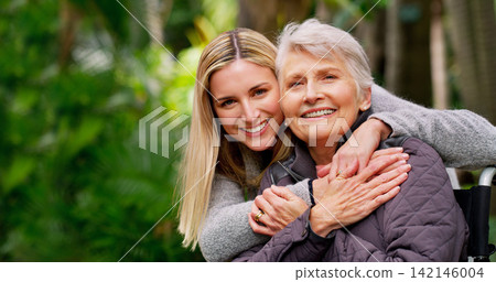 Person with disability, mother and daughter in portrait hug at park for bonding, wellness and rehabilitation. Wheelchair, senior and woman happy together in nature for support or mobility aid Person with disability, mother and daughter in portrait hug at park for bonding, wellness and rehabilitation. Wheelchair, senior and woman happy together in nature for support or mobility aid 142146004