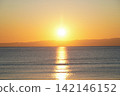 The beautiful moment of sunset, bathed in golden light, and gentle waves. 142146152