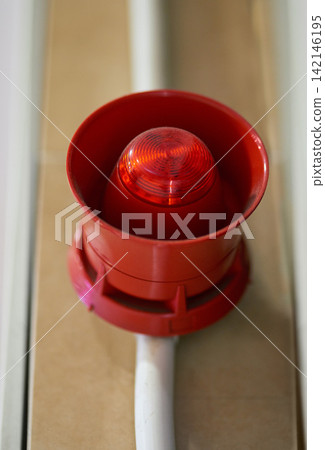 Emergency, siren and speaker for fire alarm, warning and evacuation with safety regulations or compliance. Red light on wall for security alert, noise and danger with sound, electricity and risk Emergency, siren and speaker for fire alarm, warning and evacuation with safety regulations or compliance. Red light on wall for security alert, noise and danger with sound, electricity and risk 142146195