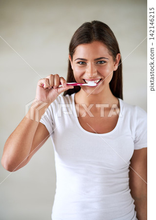 Portrait, woman and happy with toothbrush in studio on white background for hygiene and clean teeth. Female person, smile and satisfied with toothpaste for fresh breath or brushing for oral health Portrait, woman and happy with toothbrush in studio on white background for hygiene and clean teeth. Female person, smile and satisfied with toothpaste for fresh breath or brushing for oral health 142146215