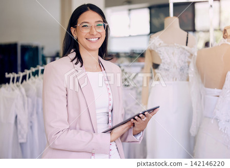 Portrait, tablet and wedding designer woman in studio for agenda, calendar or planning. Fashion, smile and happy seamstress with tape measure in workshop for appointment, online order or research Portrait, tablet and wedding designer woman in studio for agenda, calendar or planning. Fashion, smile and happy seamstress with tape measure in workshop for appointment, online order or research 142146220