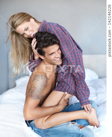 Love, hug and playful couple in bed with morning, fun and bonding in their home together. Trust, support and people embrace in bedroom with wake up games, connection or intimacy on vacation in house Love, hug and playful couple in bed with morning, fun and bonding in their home together. Trust, support and people embrace in bedroom with wake up games, connection or intimacy on vacation in house 142146226