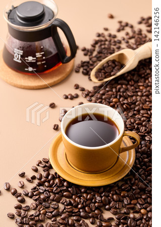 coffee poured into a cup coffee poured into a cup 142146256