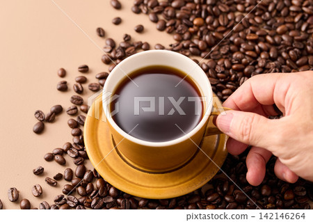 coffee poured into a cup coffee poured into a cup 142146264