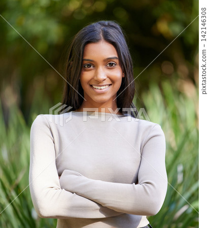 Girl, portrait and smile with arms crossed in park on vacation, relax and outdoor in nature for adventure. Woman, happy and confident person with pride, garden or holiday in spring by trees in Mumbai Girl, portrait and smile with arms crossed in park on vacation, relax and outdoor in nature for adventure. Woman, happy and confident person with pride, garden or holiday in spring by trees in Mumbai 142146308