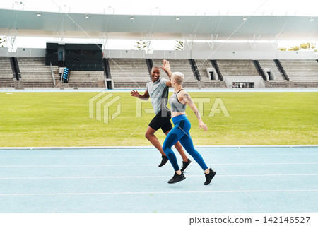 Running, track and women with high five, training for competition and energy with endurance. People, runner and athletes with hobby and progress with cardio and hand gesture with exercise or practice Running, track and women with high five, training for competition and energy with endurance. People, runner and athletes with hobby and progress with cardio and hand gesture with exercise or practice 142146527
