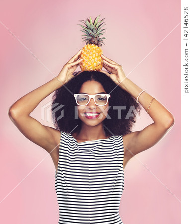 Studio, portrait and black woman with pineapple, diet and detox on pink background. Health, nutrition and gut digestion for weight loss and vitamins for female model, vegan and vitamin c for fiber Studio, portrait and black woman with pineapple, diet and detox on pink background. Health, nutrition and gut digestion for weight loss and vitamins for female model, vegan and vitamin c for fiber 142146528