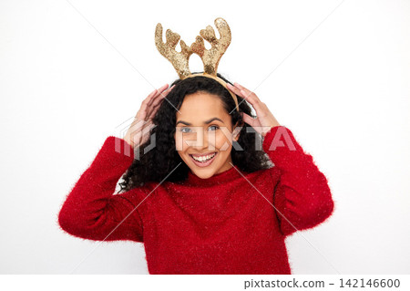 Christmas, reindeer and portrait of woman with fashion on holiday or vacation in white background. Studio, model and girl with festive style of headband for merry xmas celebration with happiness Christmas, reindeer and portrait of woman with fashion on holiday or vacation in white background. Studio, model and girl with festive style of headband for merry xmas celebration with happiness 142146600
