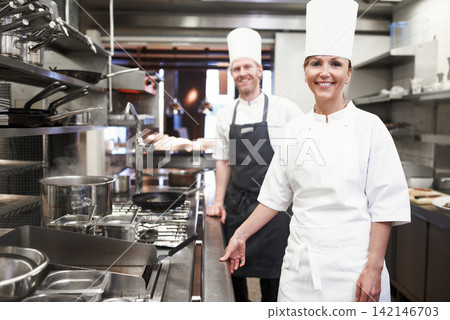 Restaurant, chef and portrait of people in kitchen for hospitality service, teamwork or career. Fine dining, cook and smile with collaboration in food industry for catering, job or culinary in France Restaurant, chef and portrait of people in kitchen for hospitality service, teamwork or career. Fine dining, cook and smile with collaboration in food industry for catering, job or culinary in France 142146703