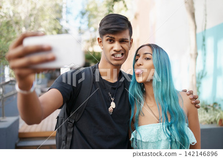 Selfie, funny or happy couple on social media in college, university or campus to relax together. Students, Indian woman or man in picture, vlog or photo for bonding with hug, support or mobile app Selfie, funny or happy couple on social media in college, university or campus to relax together. Students, Indian woman or man in picture, vlog or photo for bonding with hug, support or mobile app 142146896