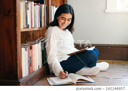 Research, woman and student in library, searching and school with education, studying and knowledge. Person on the floor, college or girl with novel, university or bookshelf with scholarship or notes Research, woman and student in library, searching and school with education, studying and knowledge. Person on the floor, college or girl with novel, university or bookshelf with scholarship or notes 142146957